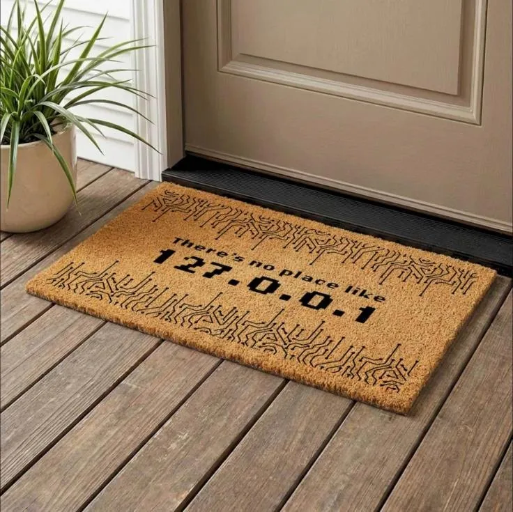 Coir doormat reading There's no place like 127.0.0.1