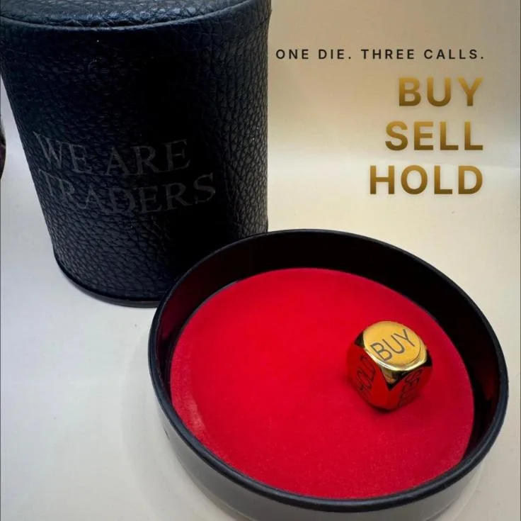 Gold die reading BUY in a leather dice cup