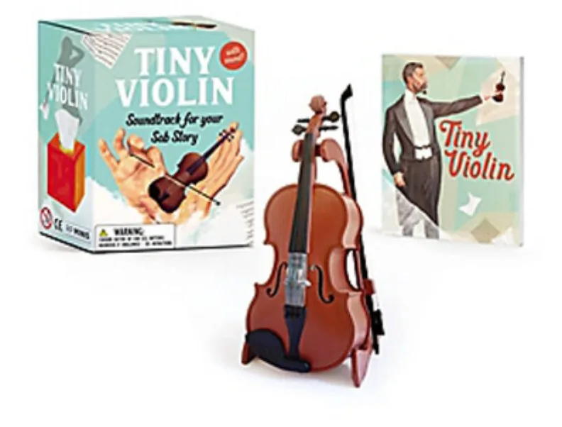 Tiny Violin kit: the box, the four-inch violin on its stand and the booklet